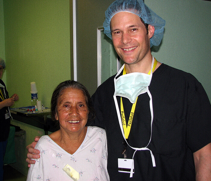 Bruce Cameron, MD with a Patient in El Salvador