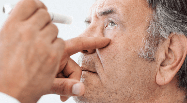 Man having his eye examined