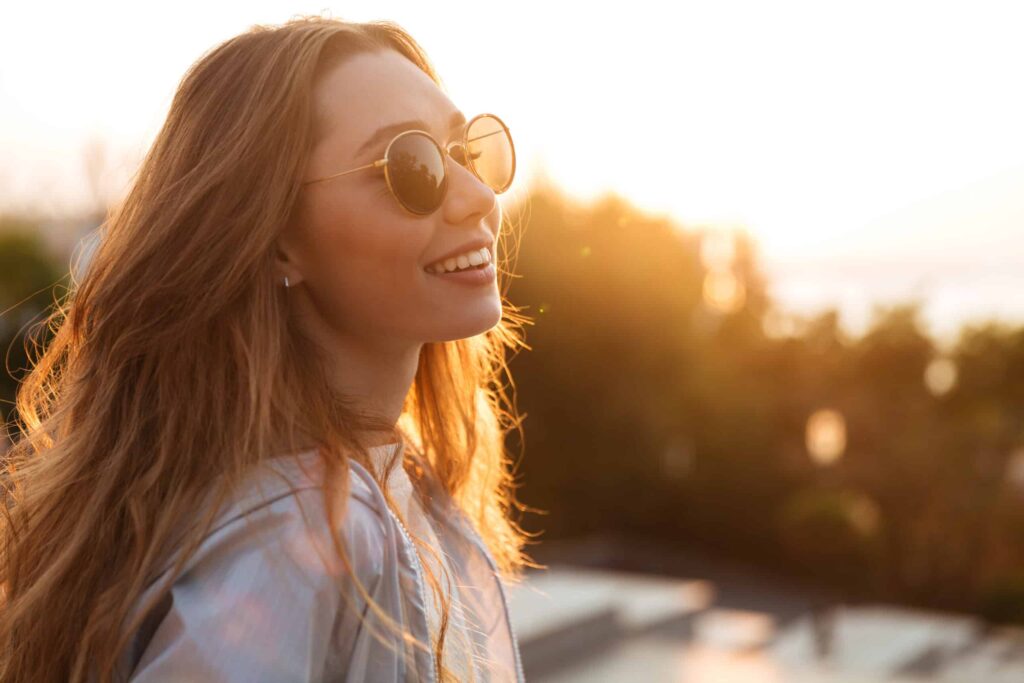 Woman outside wearing sunglasses